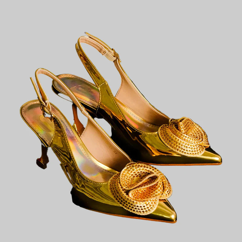 Stylish gold pointed toe pumps with ankle strap, embodying sophistication and ideal for evening events and elegant gatherings.
