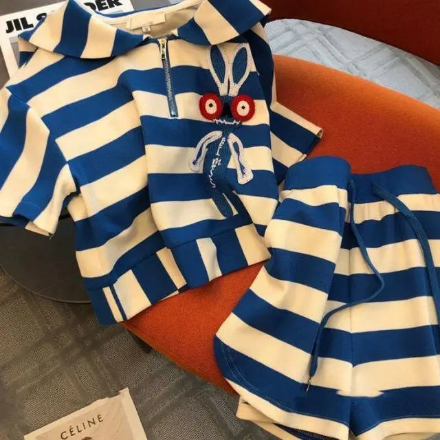 Flat lay of the Elegant Women's Casual Striped Two-Piece Sportswear Set, displaying its attractive design details, including the turn-down collar and drawstring shorts.