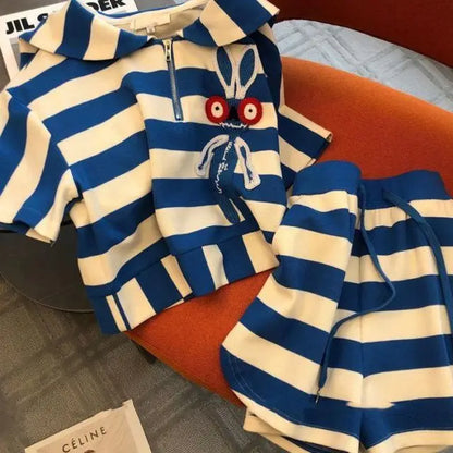 Flat lay of the Elegant Women's Casual Striped Two-Piece Sportswear Set, displaying its attractive design details, including the turn-down collar and drawstring shorts.