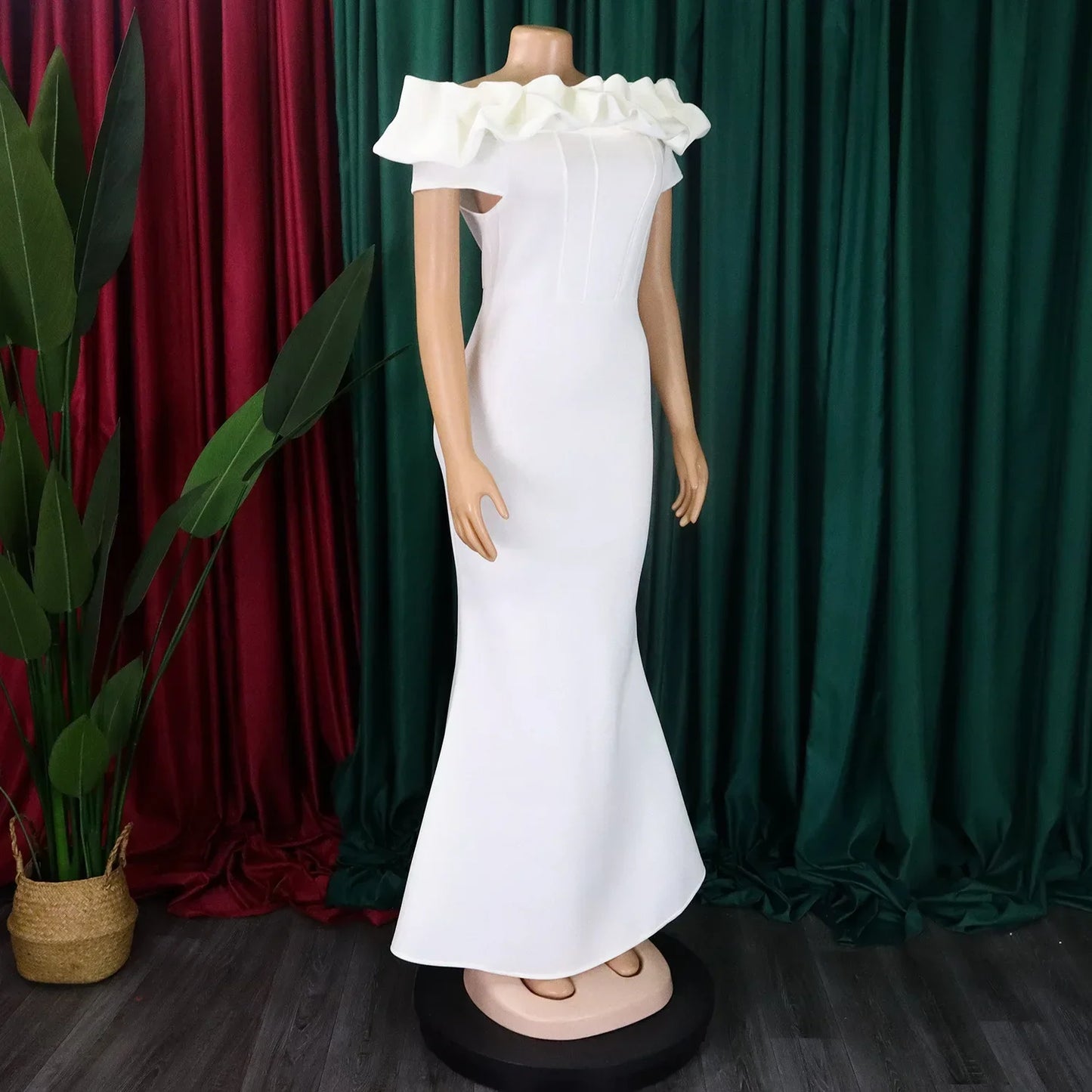 Elegant off shoulder mermaid dress in solid colour, showcasing a chic floor-length design and short sleeves, perfect for glamorous club outings.