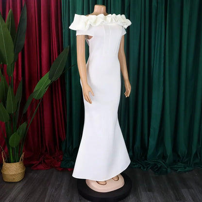 Elegant off shoulder mermaid dress in solid colour, showcasing a chic floor-length design and short sleeves, perfect for glamorous club outings.