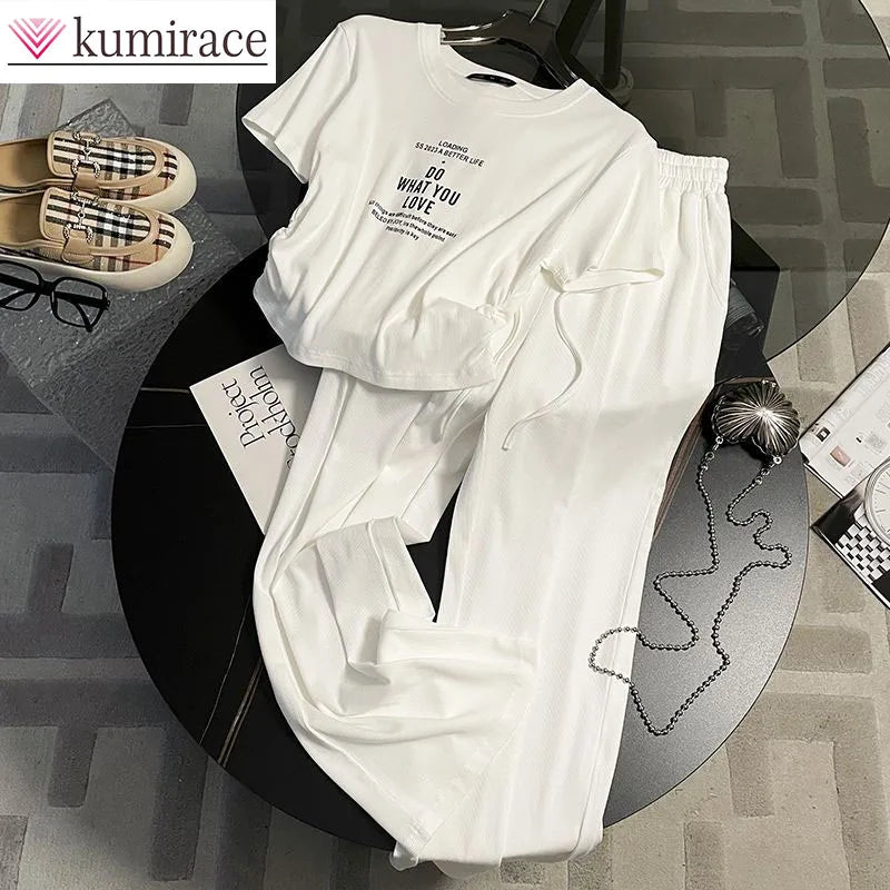 Women's luxury summer two-piece solid colour set featuring a chic loose short sleeve top and wide leg pants, designed for a relaxed yet elegant style.