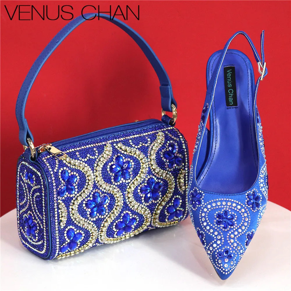 Stylish fuchsia handbag featuring a metallic handle and long chain shoulder strap, designed to match luxurious high heels.