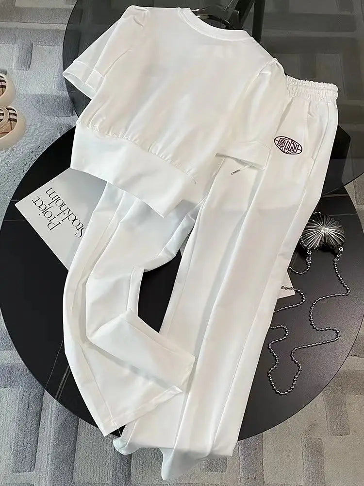 Showcasing the wide leg pants from the leisure sports set for women, highlighting the high stretch material and comfortable fit for stylish summer outings.