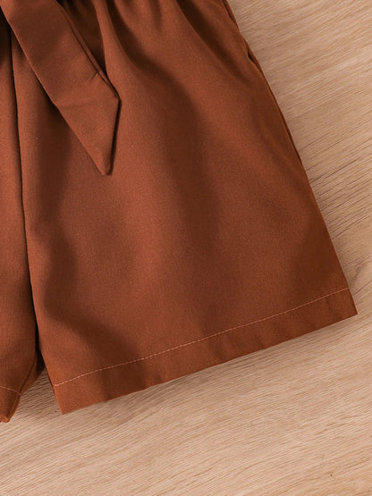 Fashion-forward girls' summer outfit flat lay, including breathable O-neck tee and brown shorts, designed for ages 4-6Y.