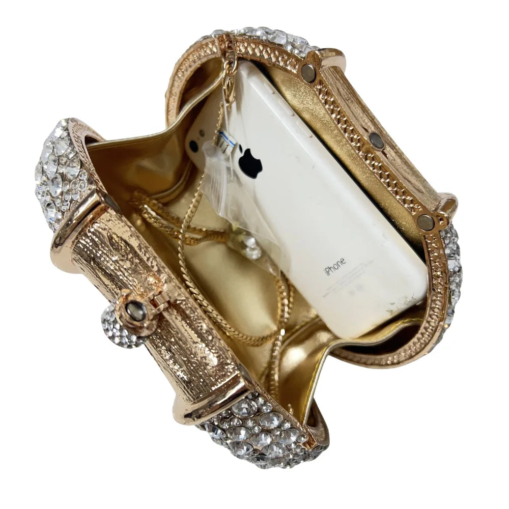 Stylish women's evening clutch bag in metallic finish, showcasing a luxurious design perfect for upscale events.