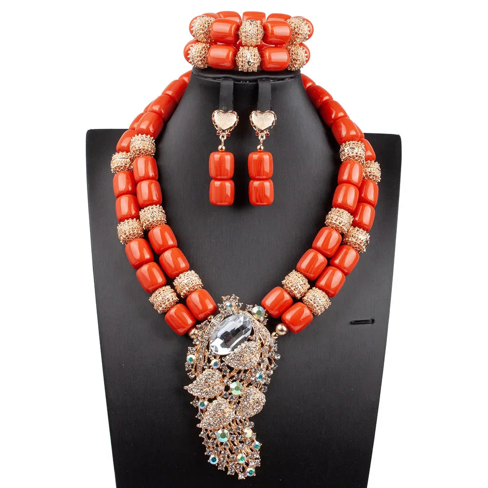 Luxurious African beads jewelry set featuring a statement necklace adorned with vibrant artificial coral, suitable for glamorous occasions.