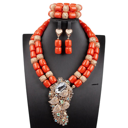 Luxurious African beads jewelry set featuring a statement necklace adorned with vibrant artificial coral, suitable for glamorous occasions.