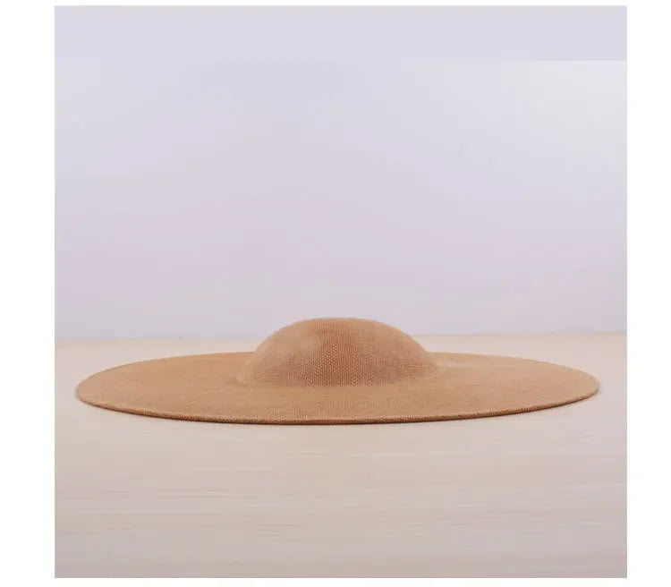 Beautifully designed polyester fascinator base, measuring 40x40CM, offering timeless sophistication for sophisticated hair accessory creations.