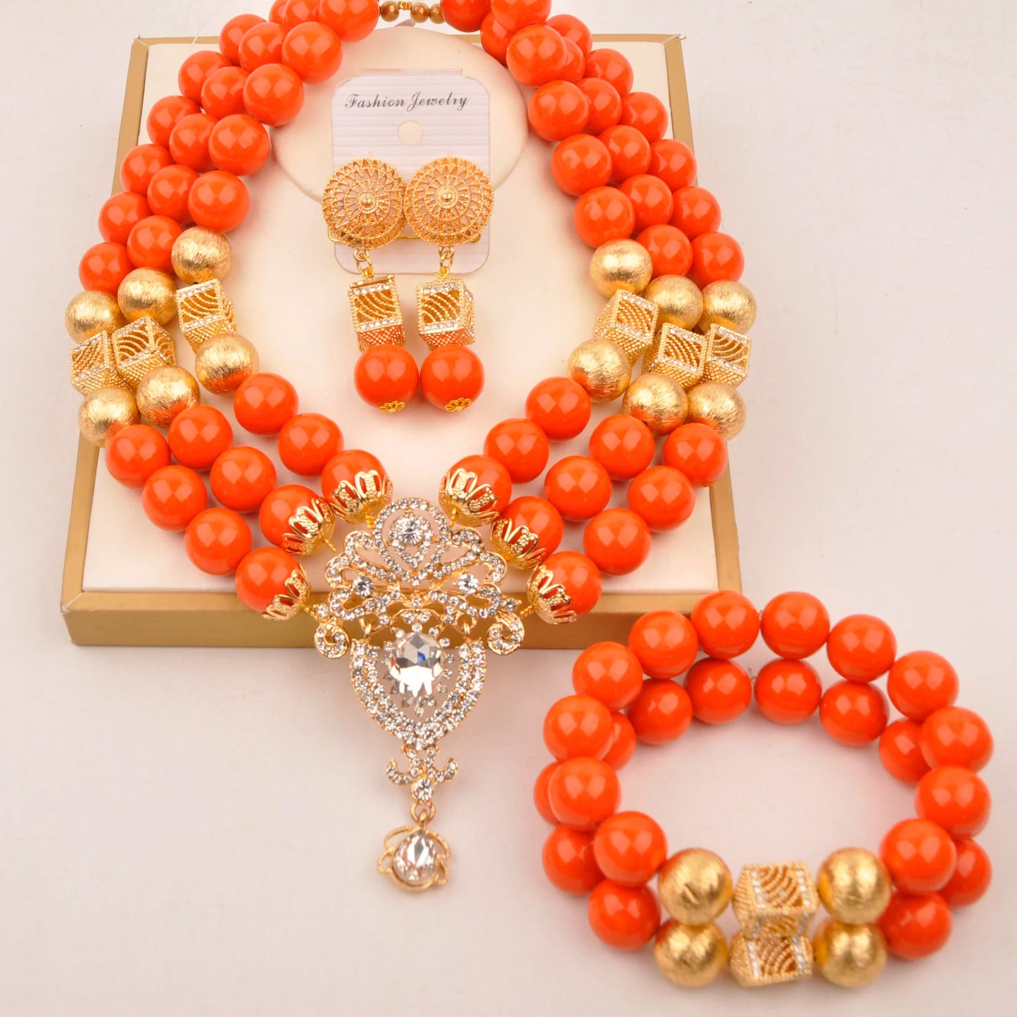 Luxury elegant Nigerian bridal jewelry set featuring exquisite artificial coral beads with a stunning necklace, bracelet, and earrings, showcasing a romantic style perfect for weddings.