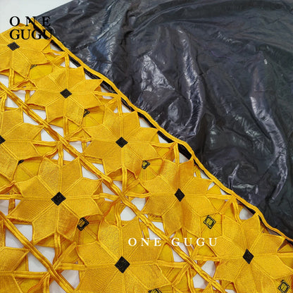 Elegant long sleeve African Bazin dress elegantly draped, reflecting traditional African fashion with a modern twist for contemporary women.