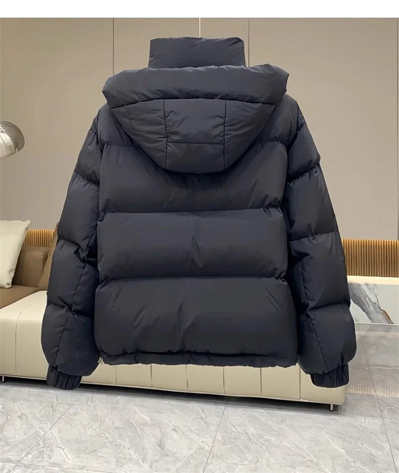 Refined women's padded parka jacket in a versatile design, tailored for comfort and elegance in chilly weather conditions.