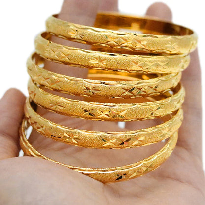 Sophisticated display of 8mm gold bracelets set in a stylish arrangement, capturing the essence of ethnic fashion for modern jewelry enthusiasts.