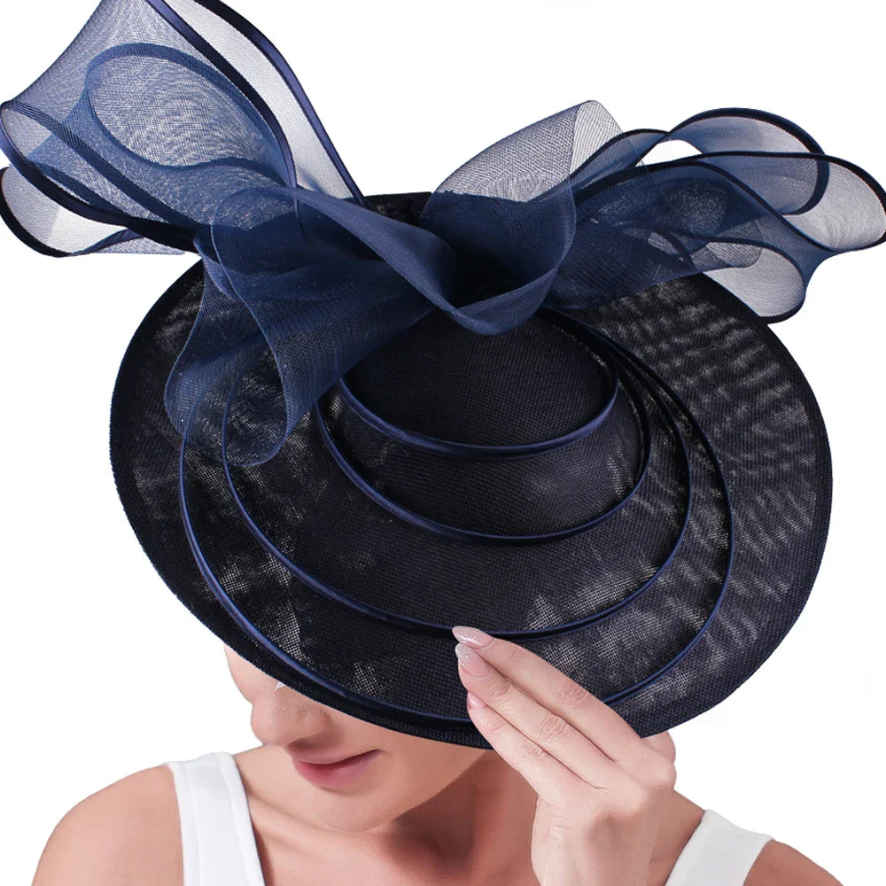 Chic and elegant large fascinator hat, featuring an intricate flower design, the perfect finishing touch for sophisticated looks at weddings and parties.