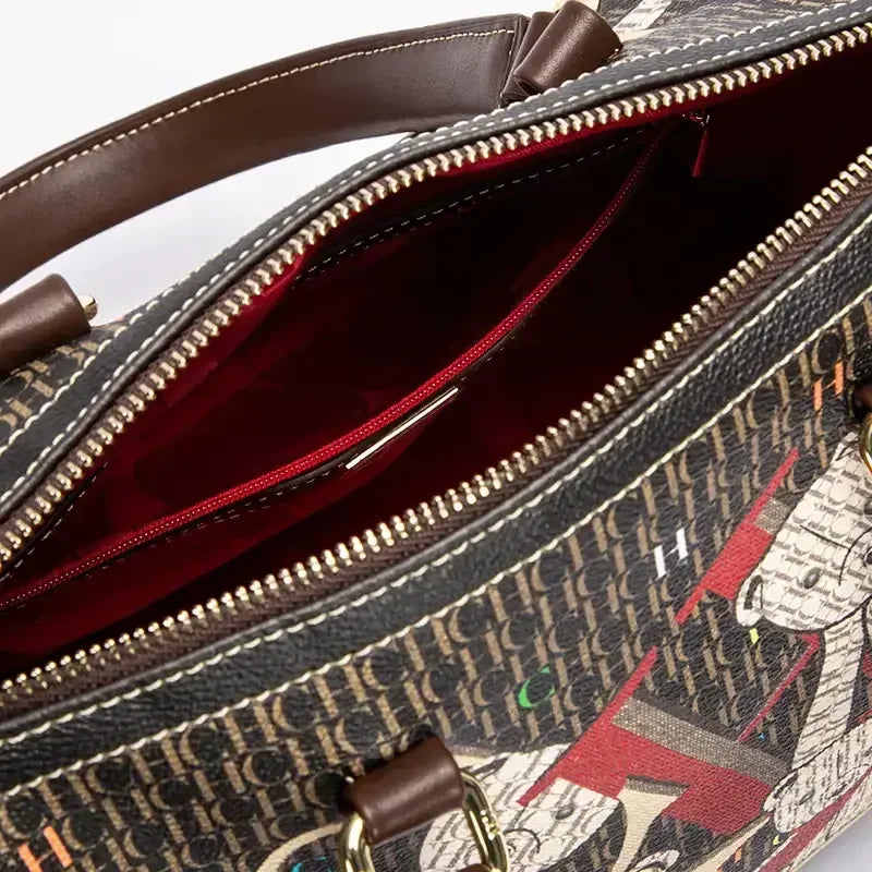 Elegant women's commuter crossbody bag featuring a colourful printed monogram and luxurious zipper closure, perfect for casual outings.