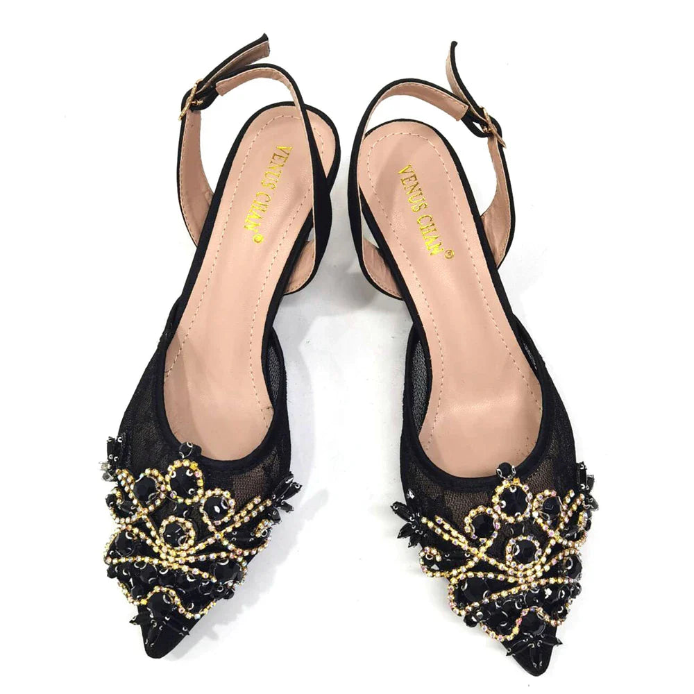 Close-up view of the luxurious crystal detailing on green lace low heel shoes, showcasing fine craftsmanship and elegance.