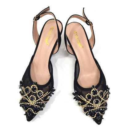 Close-up view of the luxurious crystal detailing on green lace low heel shoes, showcasing fine craftsmanship and elegance.