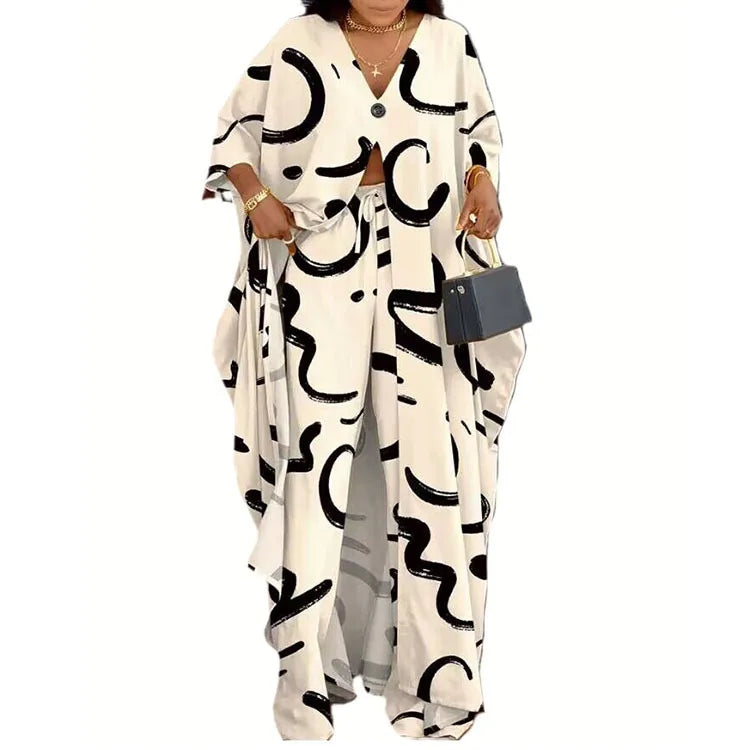 Elegantly styled women's V-neck loose long sleeved top with letter print, paired with chic wide leg pants, showcasing casual fashion sophistication for the modern woman.