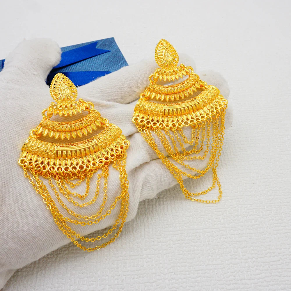 Stunning drop earrings featuring a unique geometric design in rich gold tones, ideal for enhancing any formal outfit.