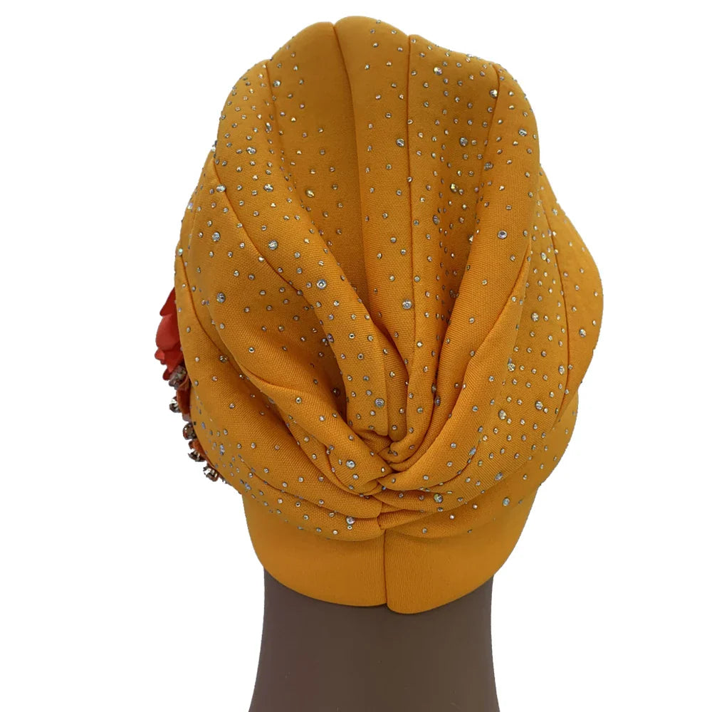 Close-up of a stunning African turban cap, featuring intricate rhinestone decoration and a sophisticated design, appealing to fashionable women.