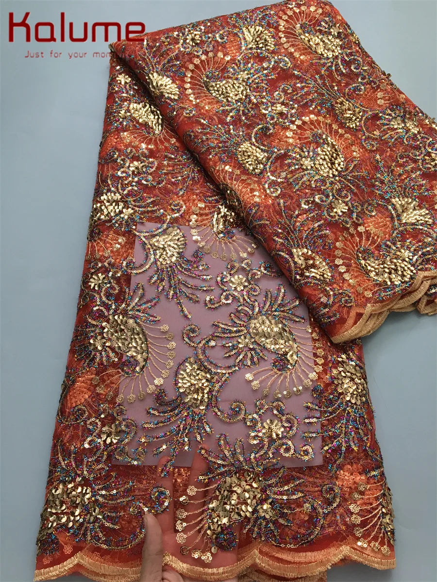 Gorgeous African lace fabric embellished with sequins, ideal for creating stunning elegant dresses, measuring 5 yards in length.