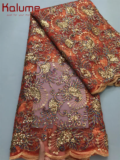 Gorgeous African lace fabric embellished with sequins, ideal for creating stunning elegant dresses, measuring 5 yards in length.