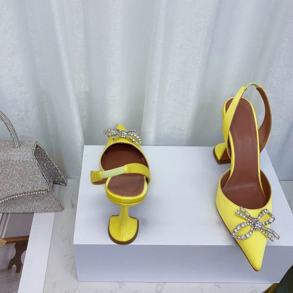 Luxury women's stiletto heels sandals featuring elegant rhinestone bow design and pointed toe, perfect for summer parties.