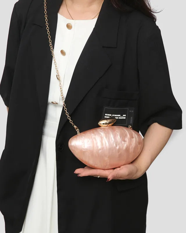 Fashionable acrylic evening purse with an elegant chain detail, designed for women who love luxury.