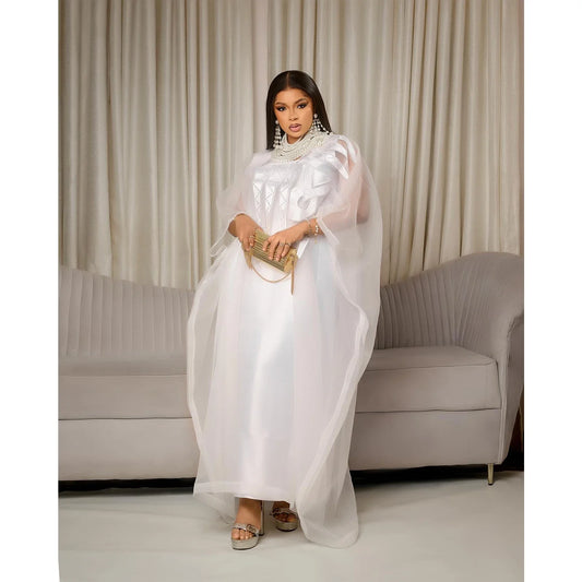 Elegant plus size white embroidered African abaya dress showcasing intricate embroidery, perfect for special occasions and church gatherings.