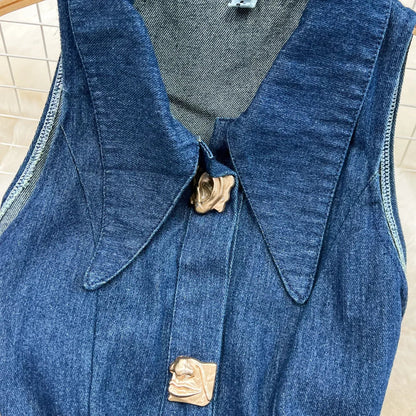 Sophisticated women's denim dress, mid-calf length with a natural waistline, blending casual style with a touch of luxury.