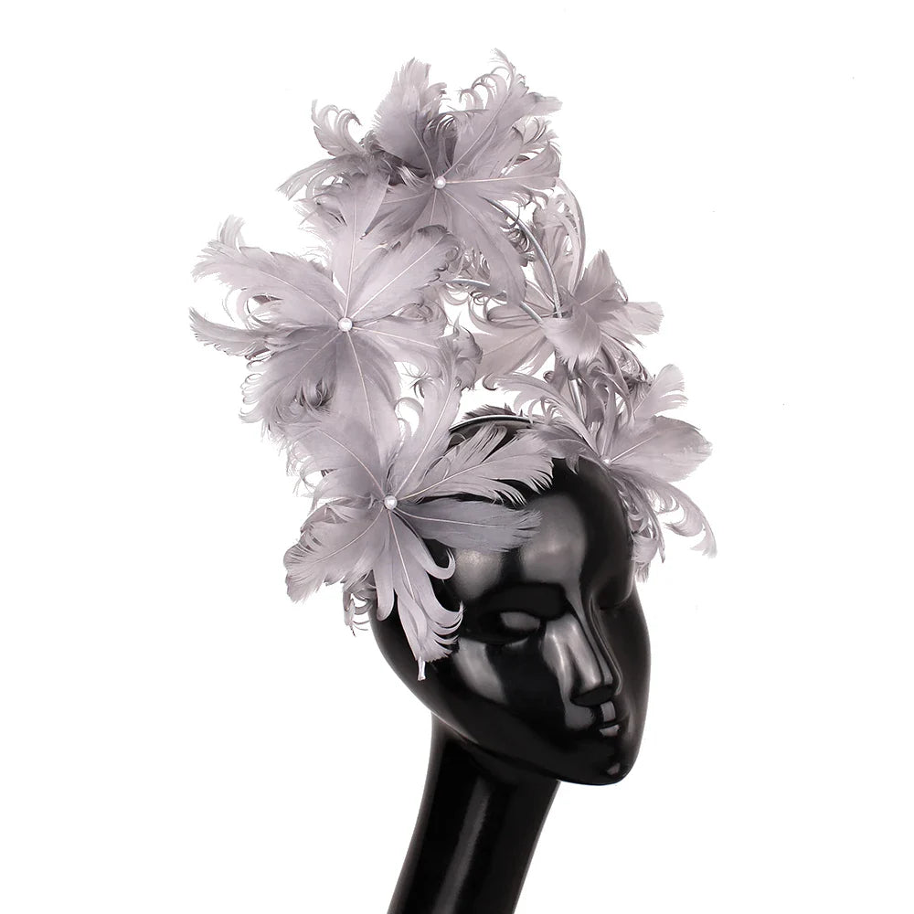 Luxurious blue feather wedding fascinator, designed to elevate bridal attire and enhance elegance on special occasions.