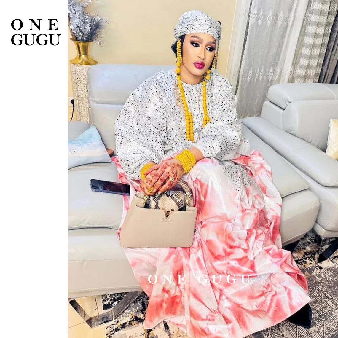 Premium Nigerian Bazin Riche Dashiki gown in majestic blue with intricate embroidery lace decorations, ideal for elegant party occasions.