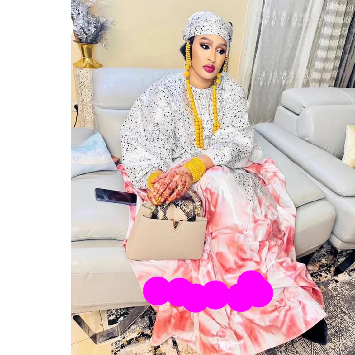 Chic and sophisticated Bazin Riche gown showcasing rich African heritage, adorned with beautiful lace and decorative stones for a touch of luxury.