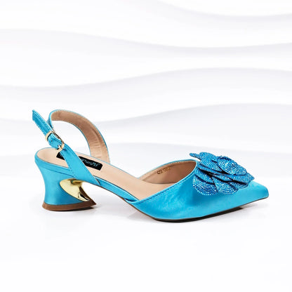 QSGFC Women's Elegant Pointed Toe Mid-Heel Evening Pumps in luxurious wine colour, featuring a stylish ankle strap and handcrafted floral details, perfect for special occasions.