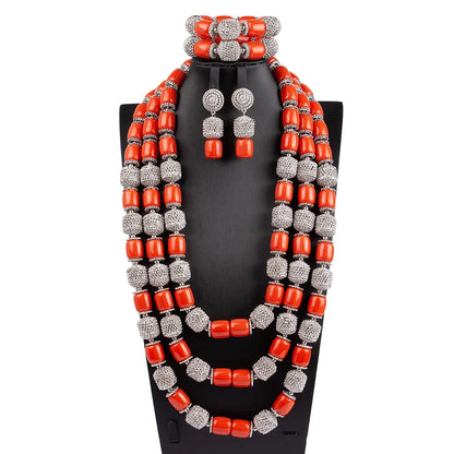 Stunning luxury African beads jewelry set featuring a statement necklace, earrings, and bracelet, crafted with artificial coral and a classic plant shape design.