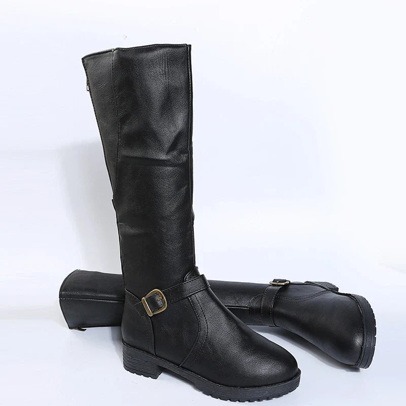 Elegant knee-high women’s platform boots crafted from high-quality PU leather featuring a chic square heel and sophisticated buckle detail.