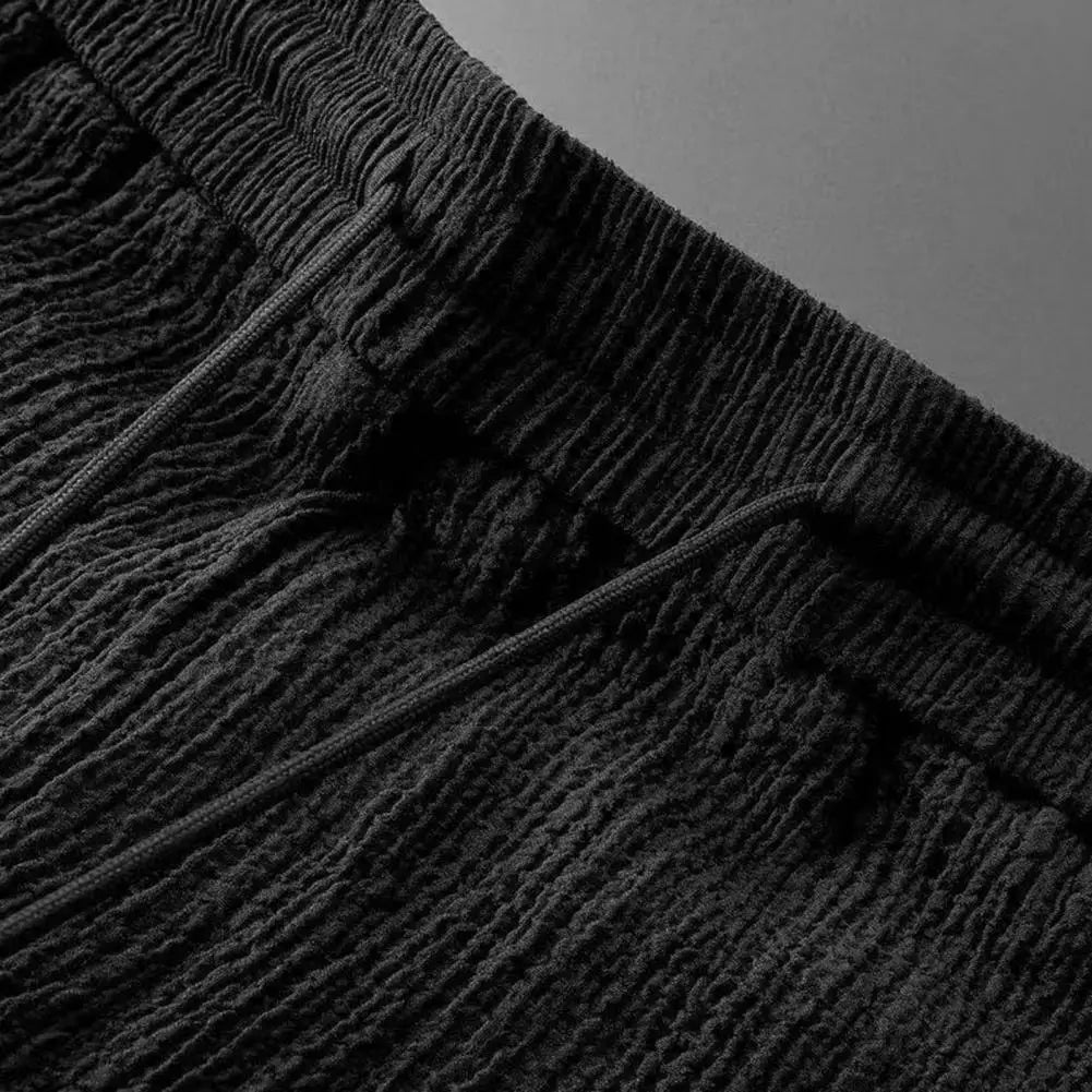 Luxurious 2-piece summer men's casual suit featuring a short sleeve shirt and long pants, designed with an elastic waistband for ultimate comfort.