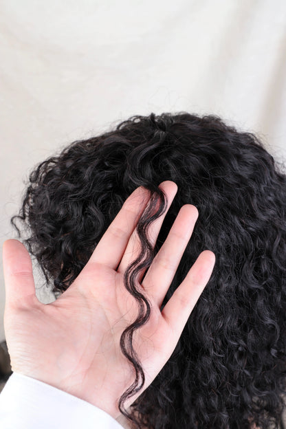 Elegant model wearing a 14-20 inch Jerry Curly Pixie Bob Cut Human Hair Wig, illustrating its seamless blend and natural movement.