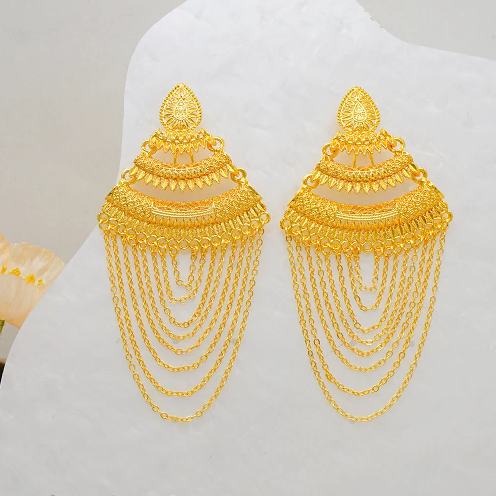 Fashion-forward geometric earrings in striking gold colour, perfect for chic women attending upscale events.
