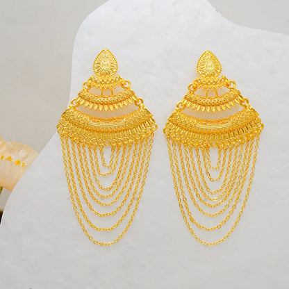 Fashion-forward geometric earrings in striking gold colour, perfect for chic women attending upscale events.