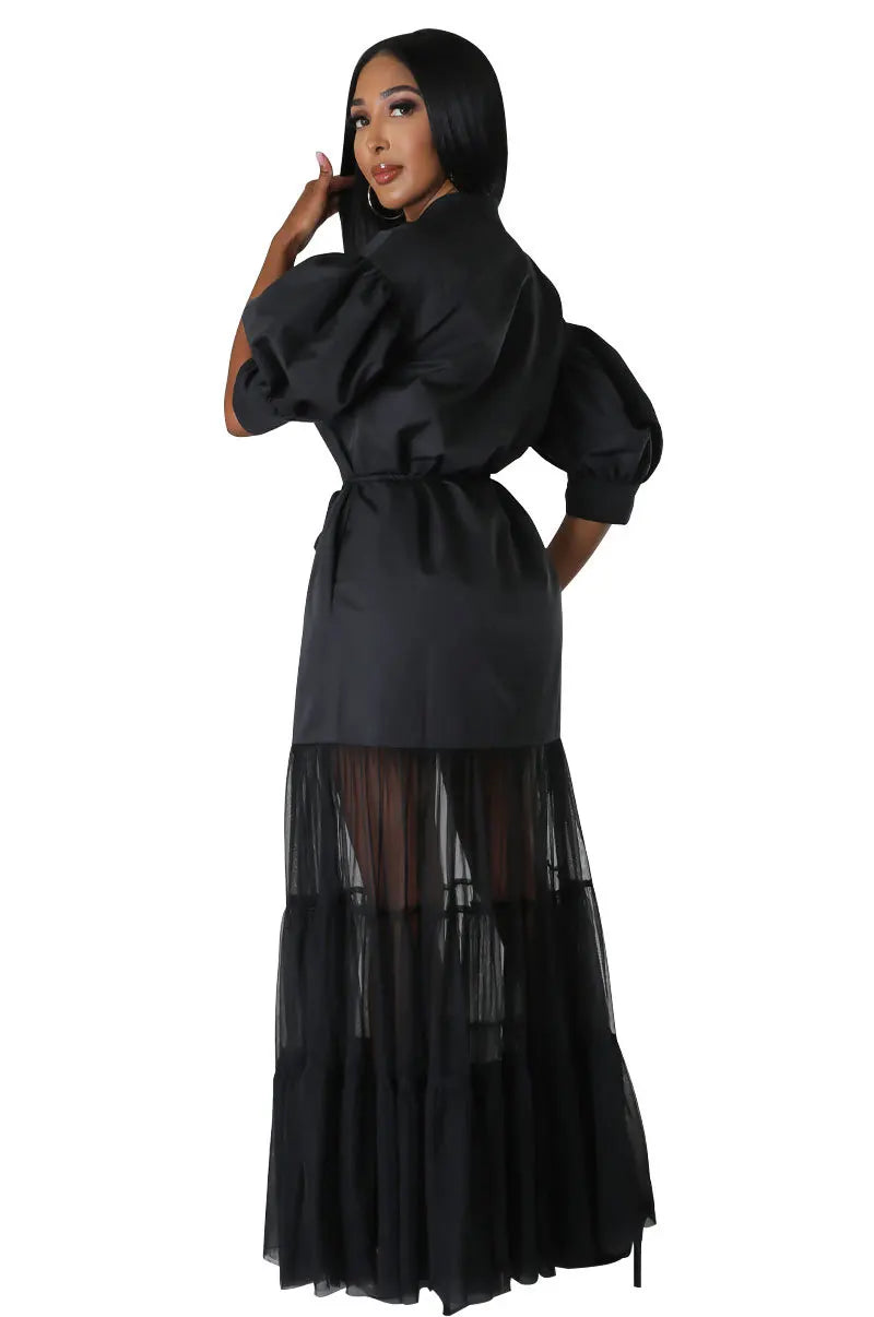 Close-up of the intricate lace-up detail on a chic women's ankle-length dress, showcasing luxurious craftsmanship.