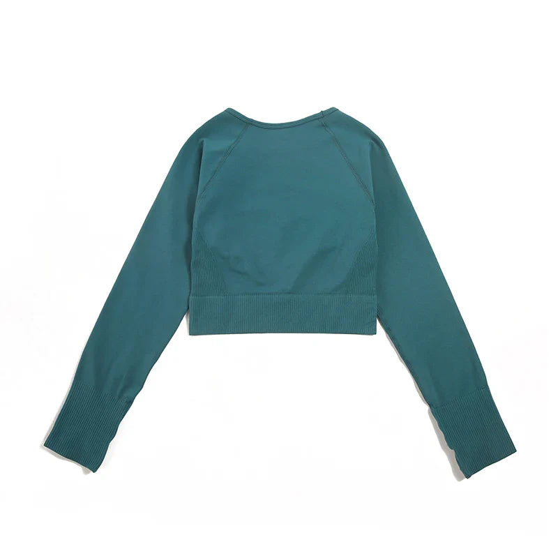 Luxurious WAREBALL seamless yoga set for women, featuring a stylish sports bra and leggings in elegant green shade, perfect for upscale fitness enthusiasts.