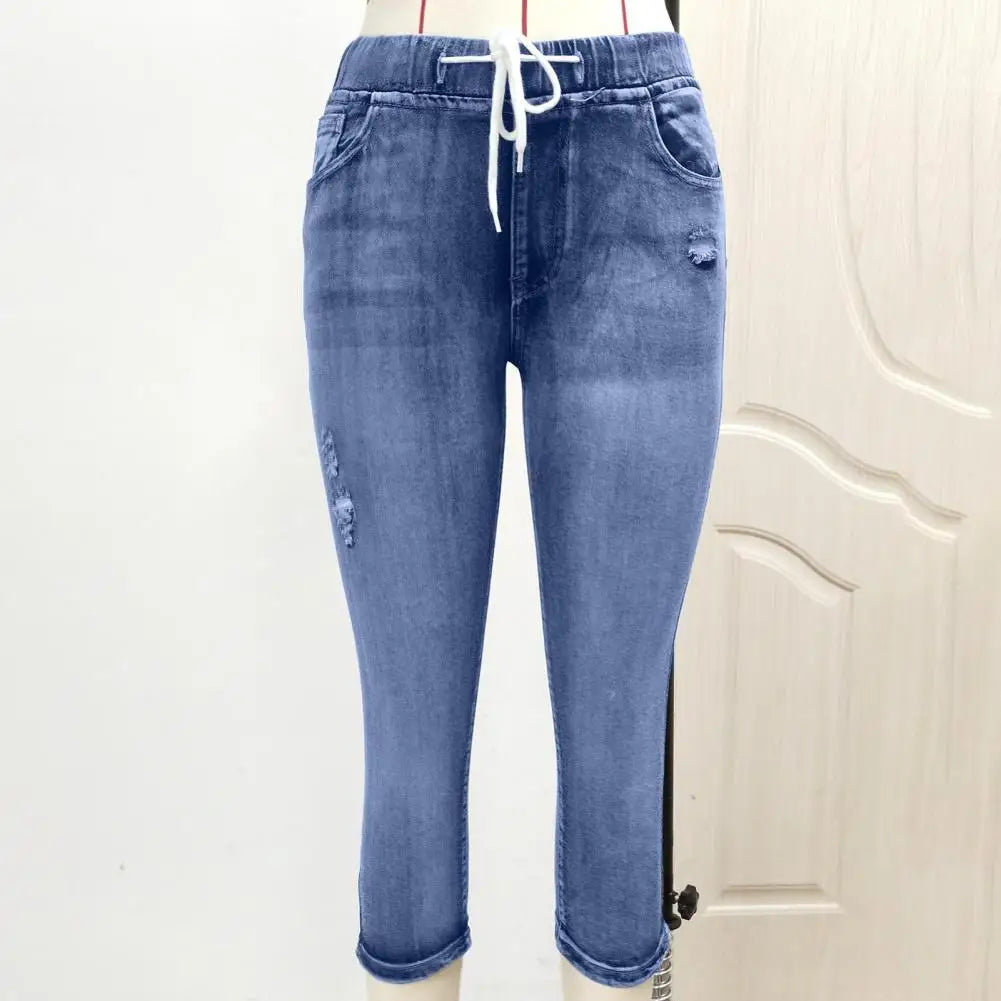 Elegant vintage denim capris designed for women, showcasing a high waist, elastic drawstring, and an exquisite relaxed fit.