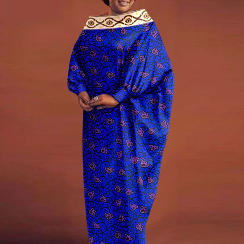 Stylish model wearing a chic O-neck bohemian maxi dress with batwing sleeves, captured in a vibrant outdoor setting, reflecting a relaxed yet elegant lifestyle.