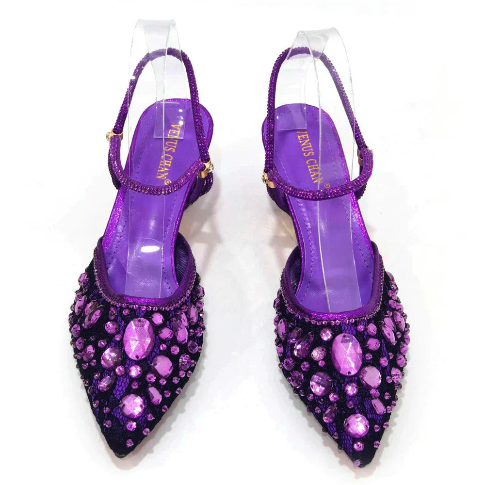 Luxury three-dimensional silver ladies heel shoes with spike heels, part of a matching bag set, perfect for elegant occasions.