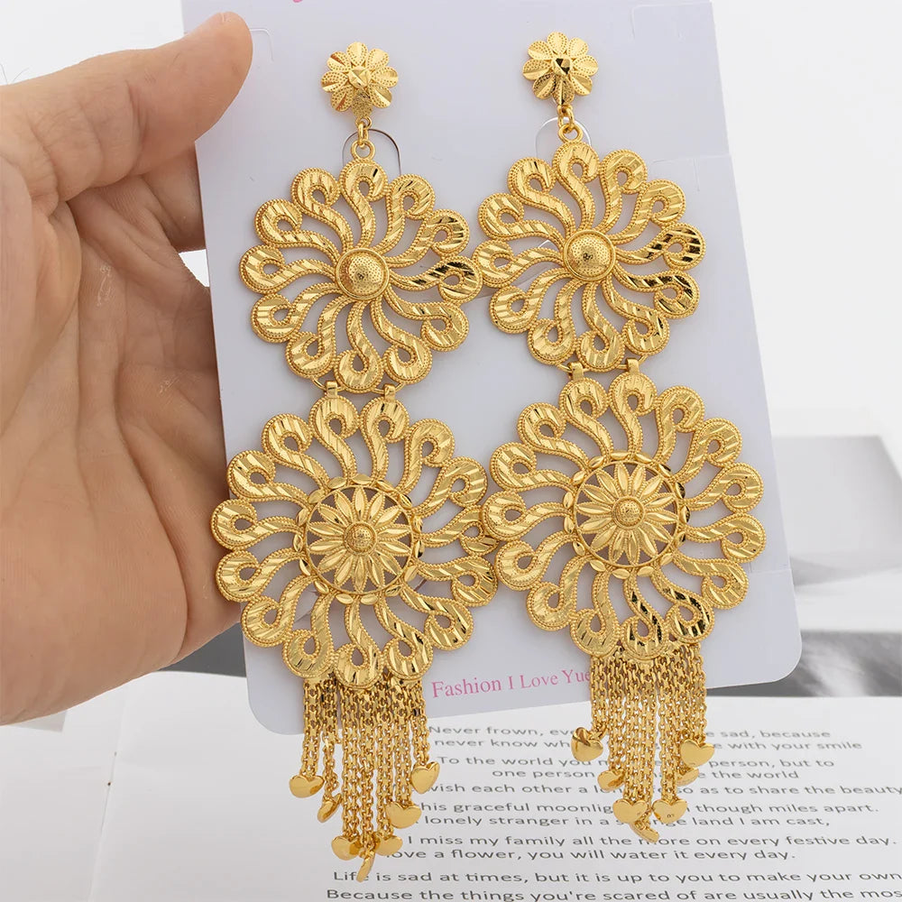 Luxury fashion drop earrings made from 18K gold plating, featuring a prominent copper tassel for a trendy and fashionable look.