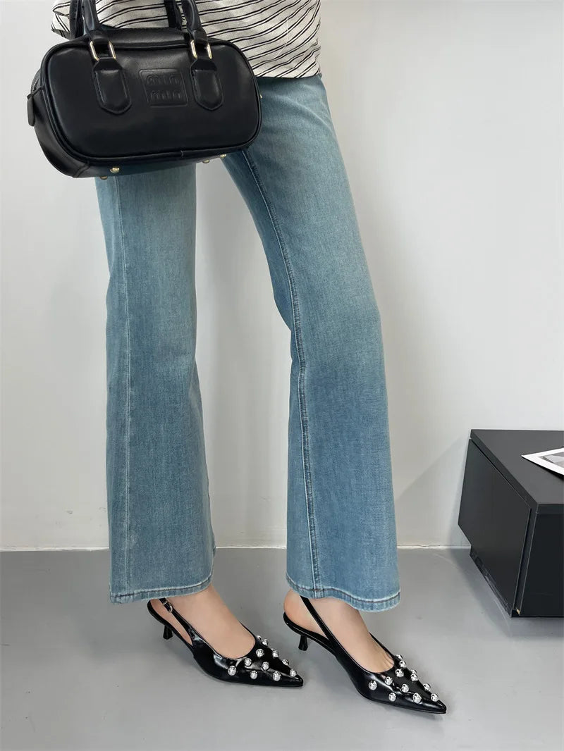 Gorgeous back strap high heeled sandals with a trendy rivet embellishment, elevating your summer wardrobe effortlessly.