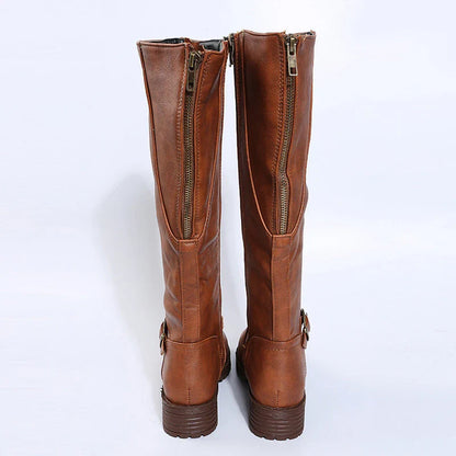 Stylish women's knee high platform boots viewed from the side, highlighting the square heel and buckle for an elegant winter look.