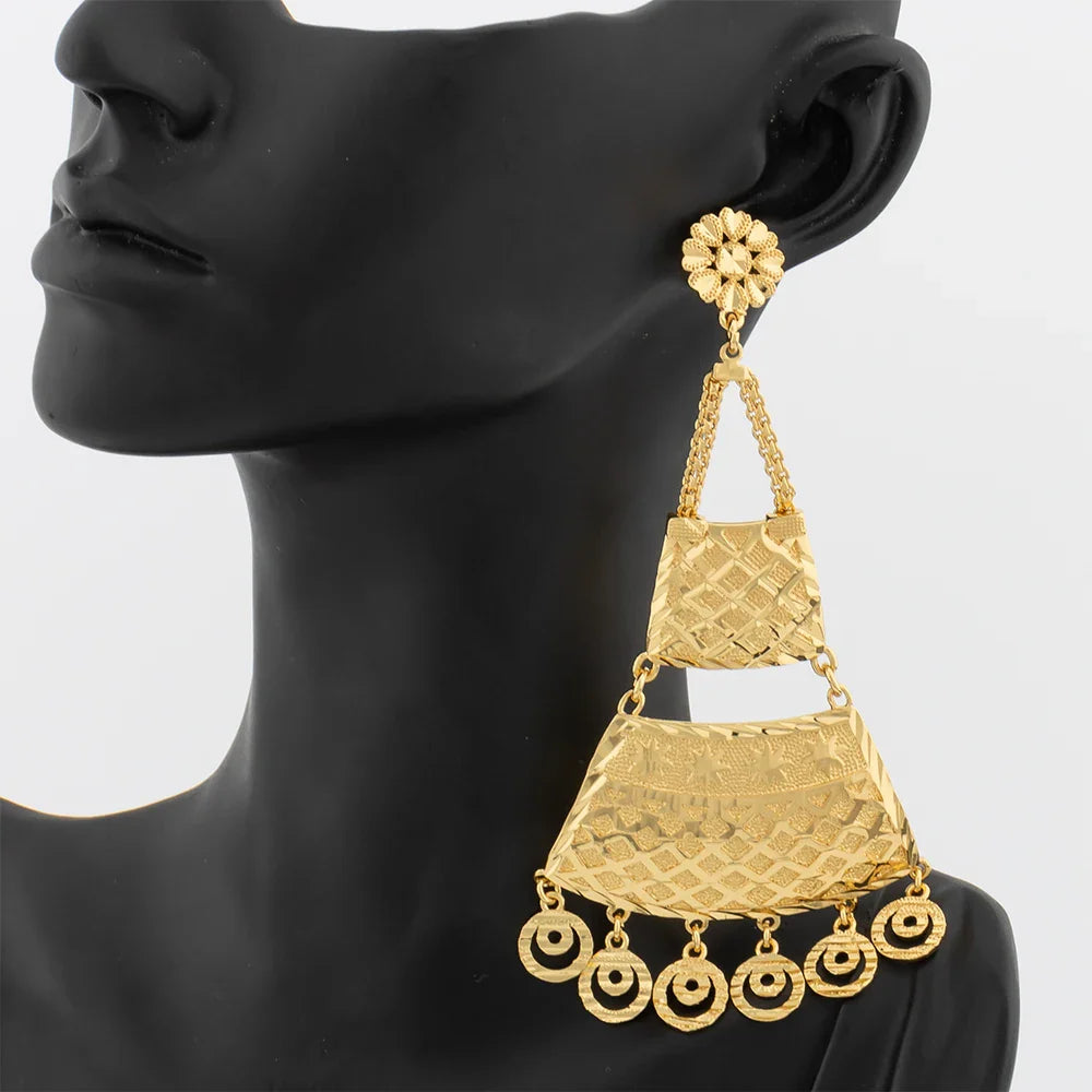 Elegant 18K gold plated drop earrings featuring a striking copper tassel design, perfect for weddings and everyday elegance.