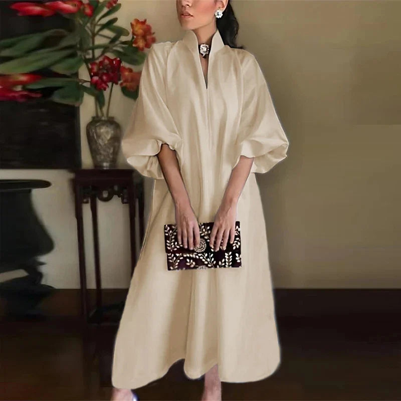 Chic and stylish women’s ankle-length maxi dress in white, featuring a v-neck and loose fit, perfect for elevating any casual to semi-formal wardrobe.